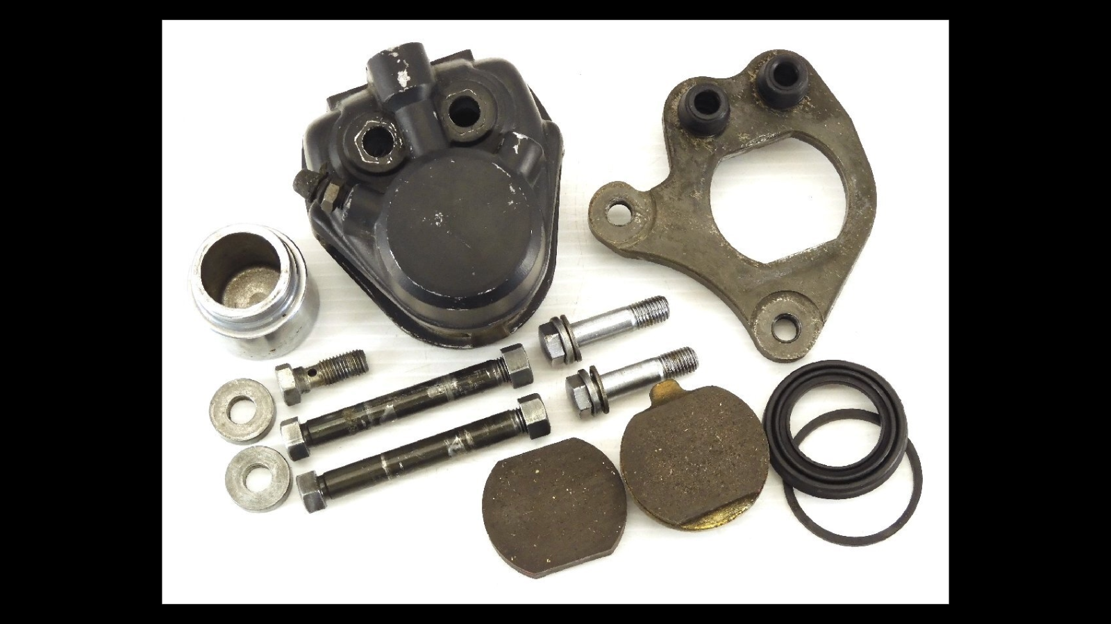 Genuine Front Brake Caliper with Support – Kawasaki Z750T / KZ750B Twin | Cleaned & Functional